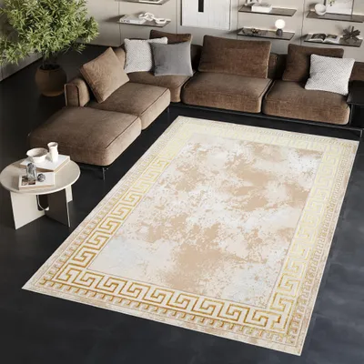 A living room scene with a sectional sofa, a coffee table, and a large rug.