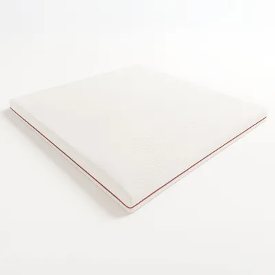 A white mattress topper with a red trim, shown on a white background.