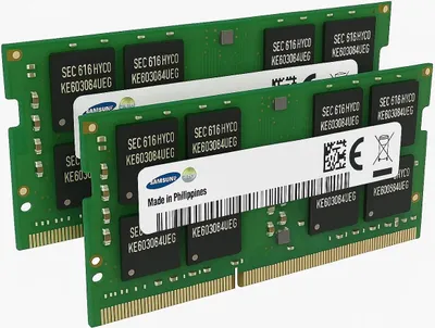 Three green circuit boards with black chips, likely RAM modules, are arranged diagonally.
