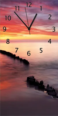 Produktbild von Wallario Design Wanduhr bedruckt, Größe 30 x 60 cm, Motiv: Sandstrand im Sonnenuntergang - Roter Himmel