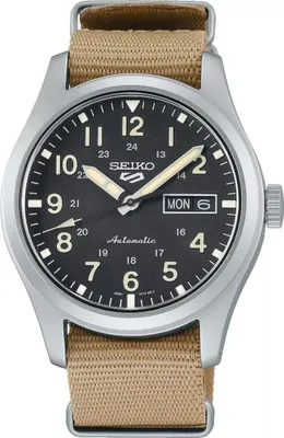 A close-up studio shot of a Seiko 5 Sports automatic watch with a black dial and a tan nylon strap.