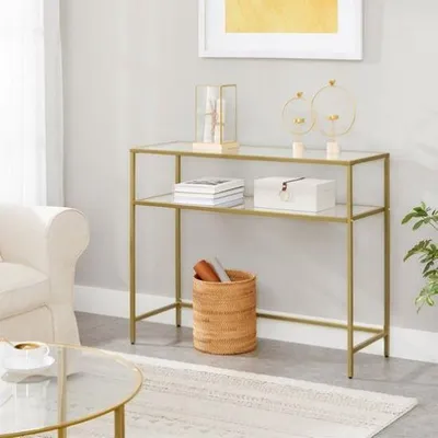 A console table with glass shelves displaying decorative items and a woven basket.