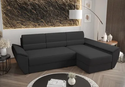 A dark gray sectional sofa is shown in a modern living room setting.