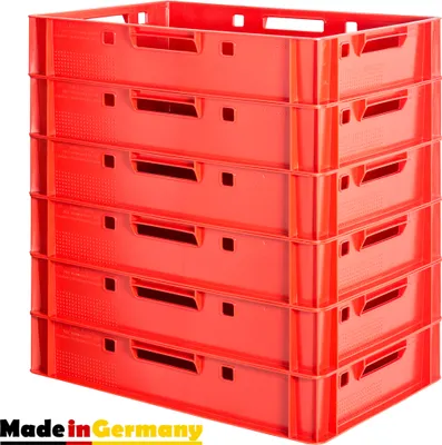 A stack of red plastic crates, with the "Made in Germany" logo in the bottom left corner.