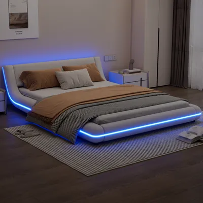 A modern bedroom with a white platform bed featuring blue LED lighting.