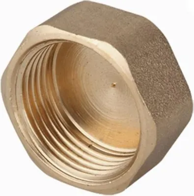 A close-up, isolated shot of a brass threaded cap.