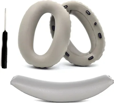A set of replacement ear pads and a headband for Sony headphones, along with a small tool.