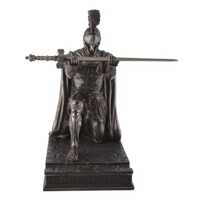 A bronze-colored figurine of a Roman centurion kneeling with a sword.