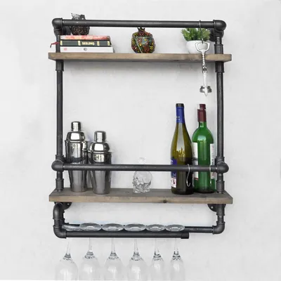 A wall-mounted industrial pipe shelf filled with barware.
