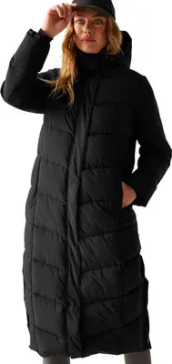 A woman wearing a black puffer coat and a black baseball cap, posing against a white background.