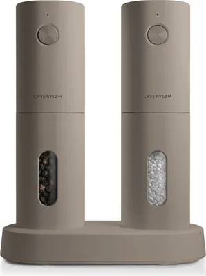 A pair of electric salt and pepper grinders on a matching base.