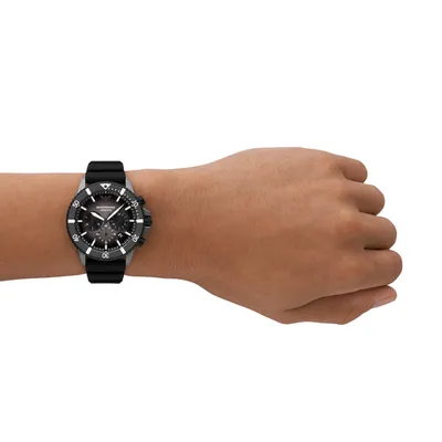 A person's wrist wearing a watch.