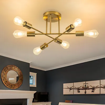 A gold-colored ceiling lamp with six exposed bulbs is mounted on a white ceiling.