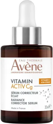 A product shot of a serum bottle against a white background.