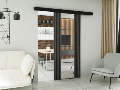 A modern living room with a sliding door system.