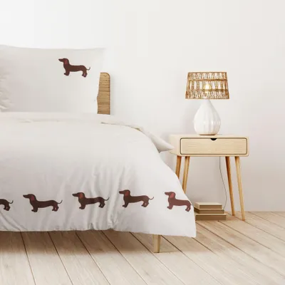 A bedroom scene with a bed and a nightstand.