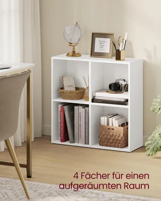 A white bookshelf with four compartments, filled with books, a basket, and decorative items, placed in a home office setting.