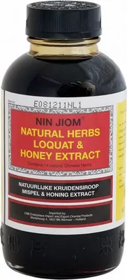 A bottle of Nin Jiom Natural Herbs Loquat & Honey Extract.