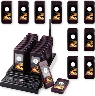A set of restaurant pagers and their charging base, displayed on a white background.