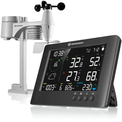 A digital weather station with an outdoor sensor unit and a display console.