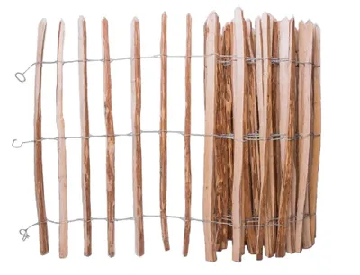 A close-up of a wooden picket fence section.