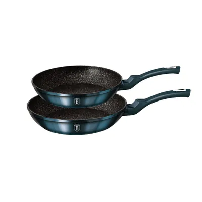 Two frying pans stacked on a white background.