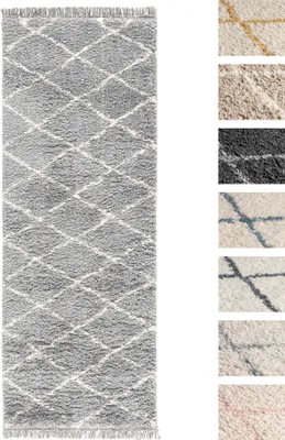 A long, narrow rug with a diamond pattern is shown against a white background. Several smaller swatches of different rug colors and patterns are displayed to the right of the main rug.