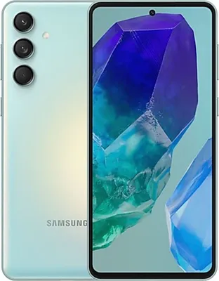 A Samsung Galaxy M55 5G smartphone with a light green back and a crystal-like wallpaper on the screen.