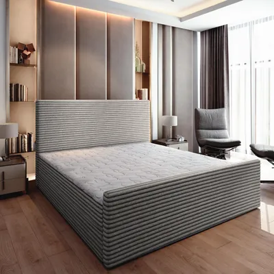 A bedroom scene featuring a bed, nightstands, and a chair.
