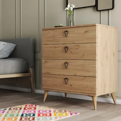 A bedroom scene with a dresser and bed.