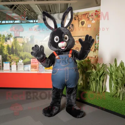 Produktbild von Schwarzer REDBROKOLY Hase als Maskottchen kostüm gekleidet in Jeans und Handschuhen