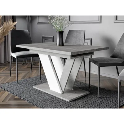 A dining table with chairs in a modern dining room setting.