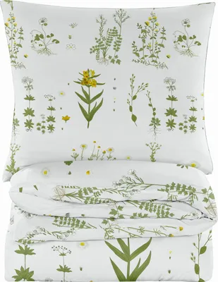 A folded duvet and pillow set with a floral pattern.
