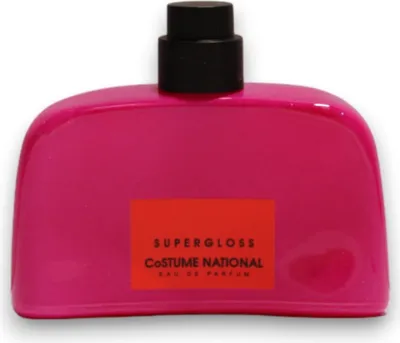 A bright pink bottle of perfume with a black cap and an orange label.