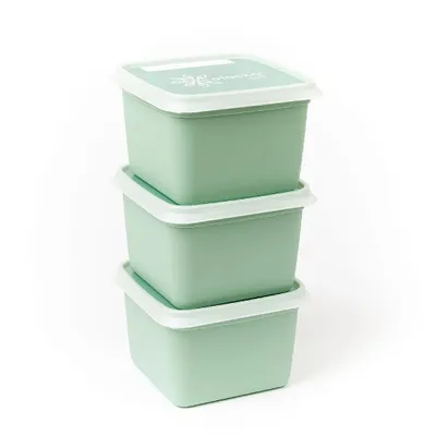 Three green food storage containers stacked on top of each other against a white background.
