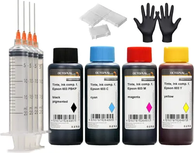 A collection of printer ink bottles, syringes, and gloves arranged on a white background.