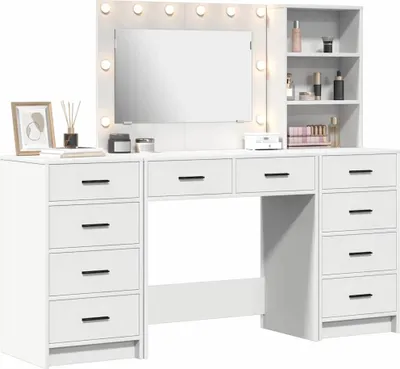 A white vanity table with a mirror and lights, and drawers.