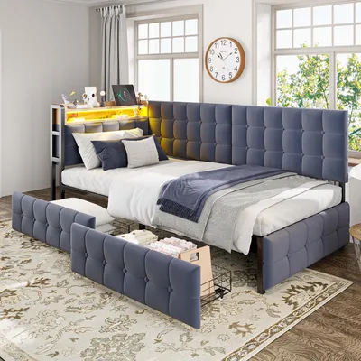 A bedroom scene featuring a gray upholstered daybed with built-in LED lighting and storage drawers.