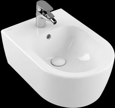 A white bidet with a chrome faucet against a black background.