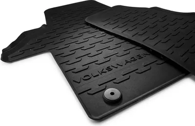 A set of black rubber floor mats for a vehicle.