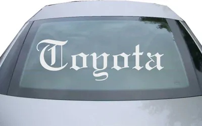 Produktbild von Indigos UG - Aufkleber Heckscheibe & Motorklappe DE6894 - silber - 600x195 mm - Coyota - Auto Scheiben Fenster Heckklappe Tuning Racing JDM - Die cut