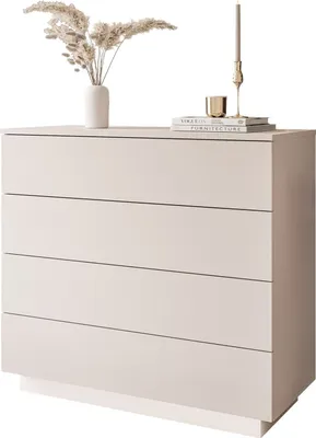 A minimalist dresser with decorative items on top.