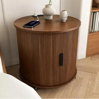 Imagen del producto de Mesa de noche cilíndrica de estilo mid-century con estación de carga, puerta corredera y acabado en nogal, dimensiones: 60x60x60 cm