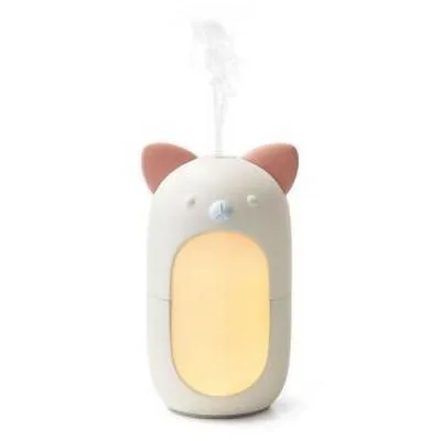 A cute, cat-shaped aroma diffuser emitting a stream of mist.