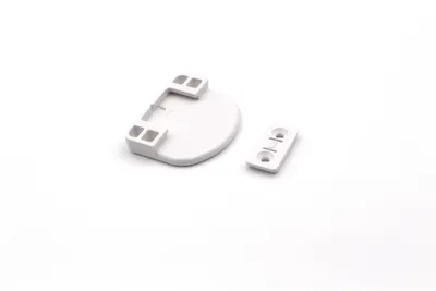 Two white plastic hardware components are shown on a white background.