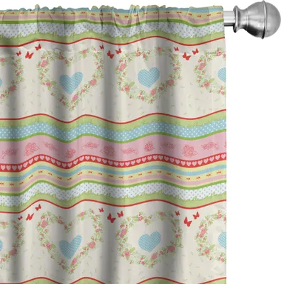 A close-up view of a curtain with a floral and heart pattern.