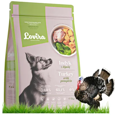 A bag of dog food with a dog and a turkey in front of it, on a white background with grass at the bottom.