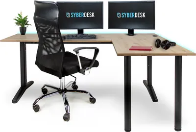 A gaming desk setup with two monitors, a chair, and accessories.