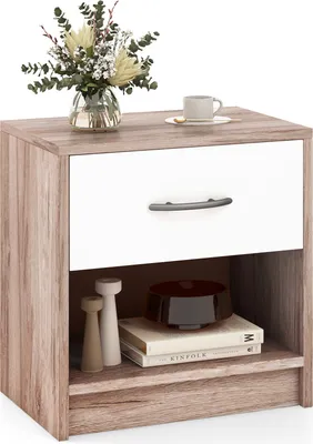 A white and wood-grain nightstand with a drawer and an open shelf, decorated with a vase of flowers and a coffee cup on top.