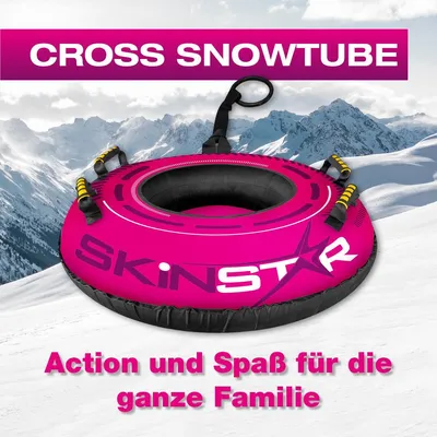 A pink snow tube on a snowy mountain slope.